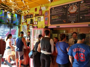 Who wouldn't want to buy doughnuts from a place like this? (The Cubs fan in me was happy to see the Arrieta jersey in Portland.) (Photo by Matt Miller)