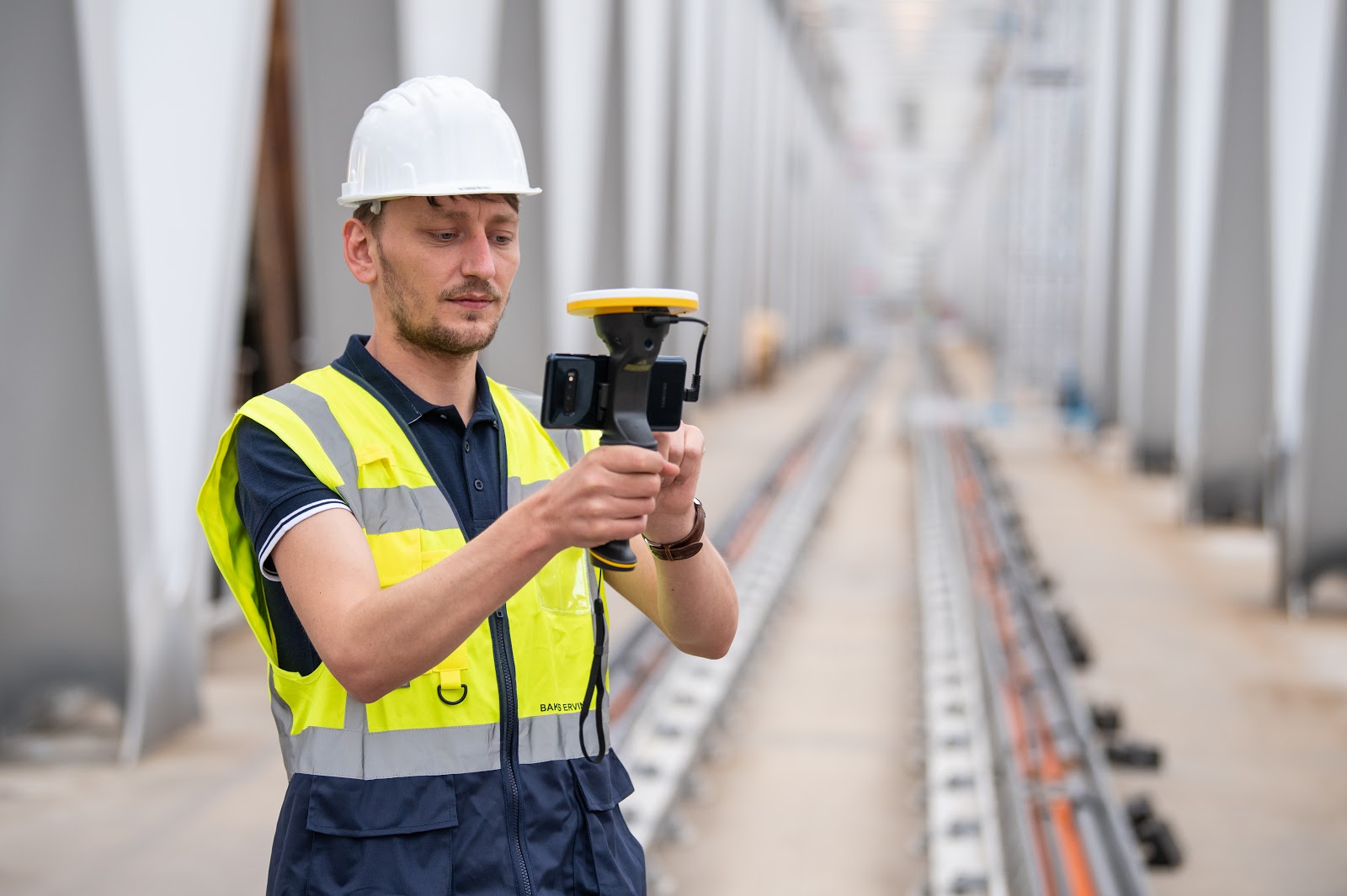 Worker using Trimble technology