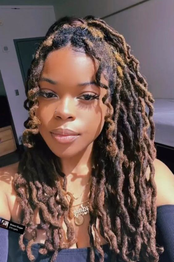 A lady rocking curly human hair dreadlocks extensions