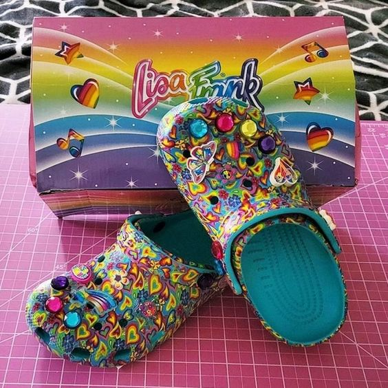 A pair of Lisa  frank crocs looking fashionable 