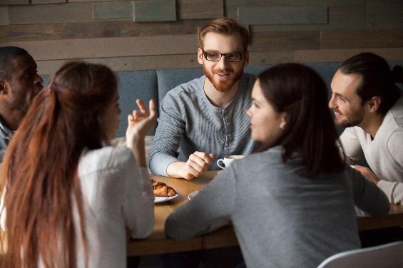A group of people sitting at a table

Description automatically generated with medium confidence