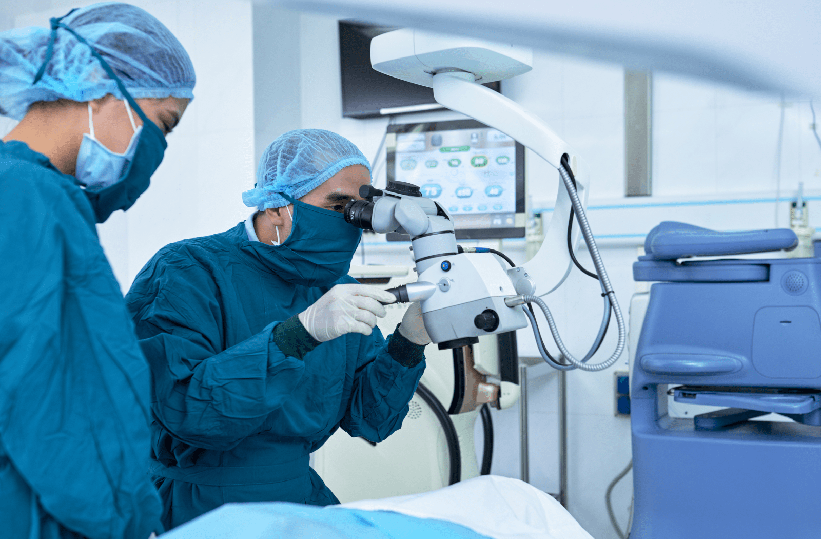 An ophthalmologic surgeon preparing for cataract surgery on a patient