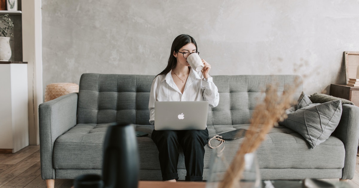 A woman drinking a cup of espresso coffee 