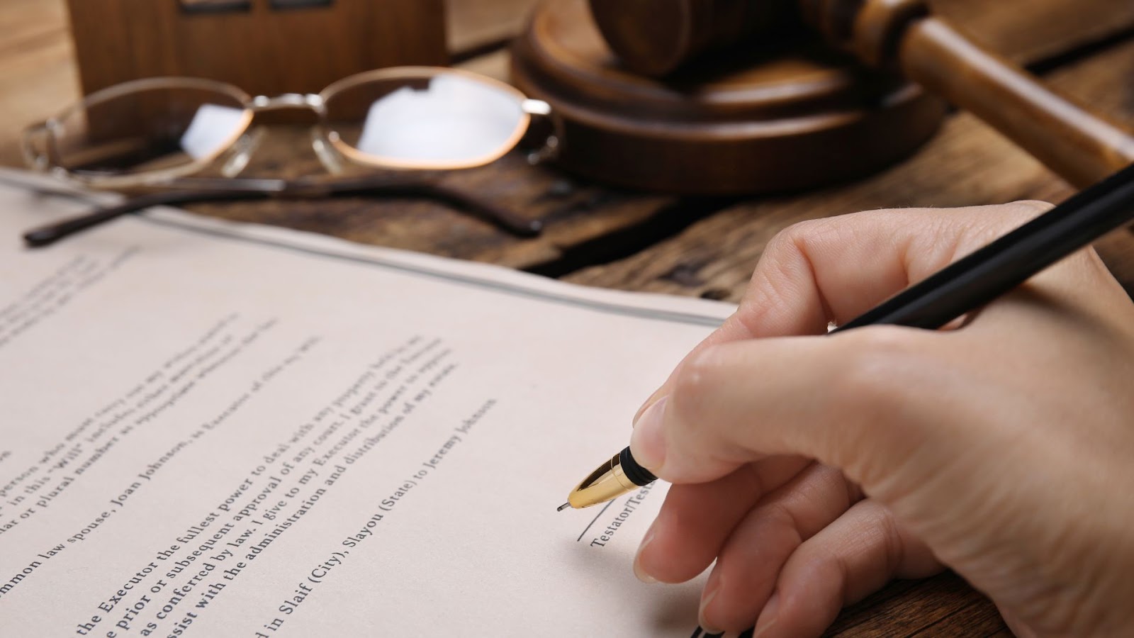 Man signing Inheritance paper will pen