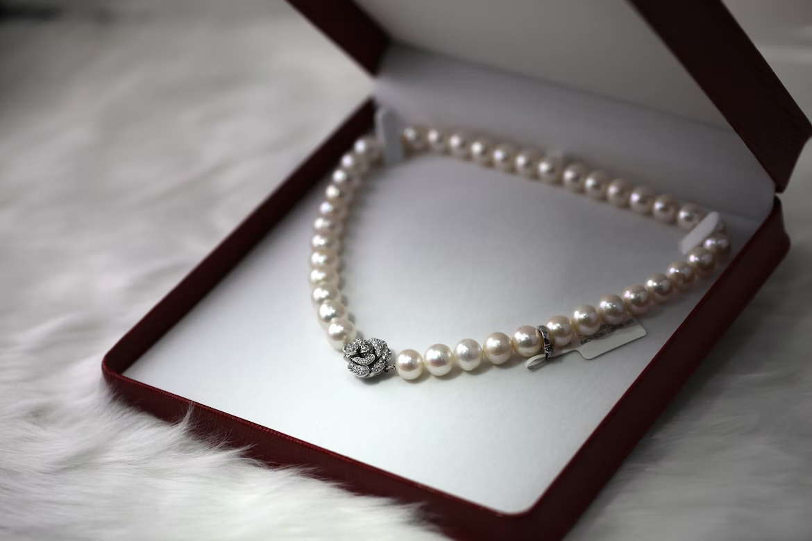 Silver necklace with pearls inside a box