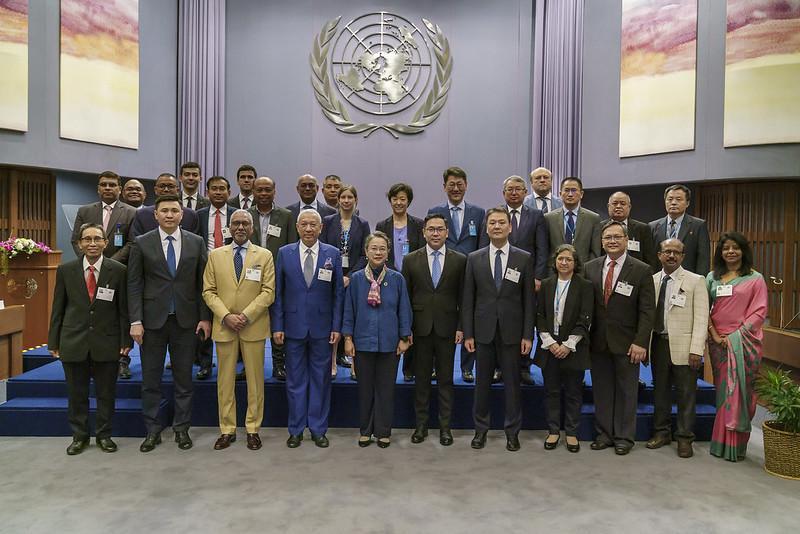 A group of people posing for a photo

Description automatically generated