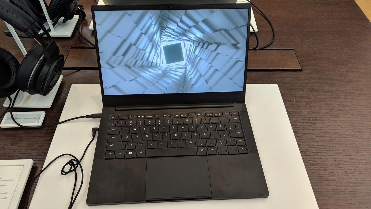 This image shows the laptop with headphone in the table.