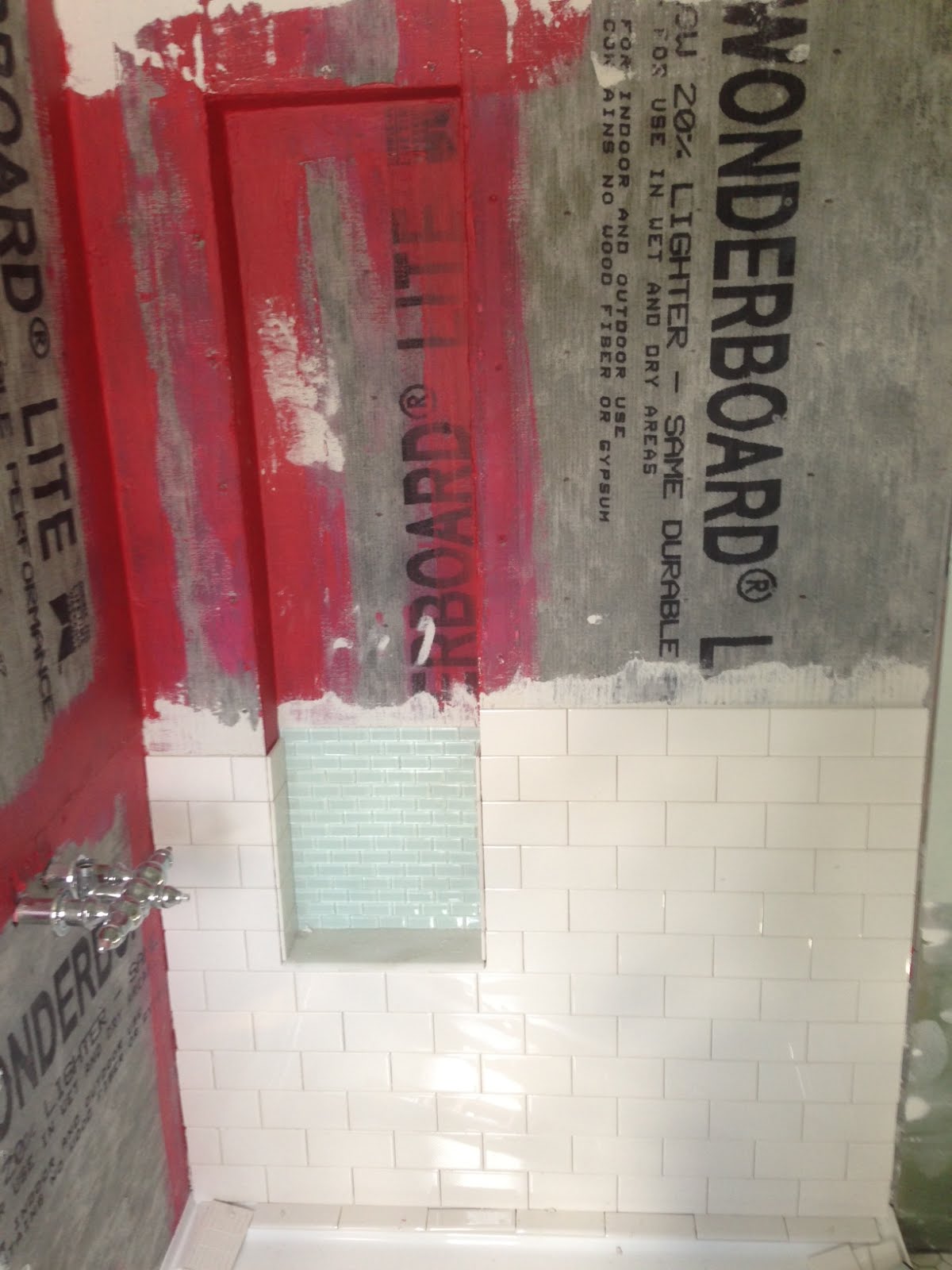 diy shower niche with glass mosaic and white subway tiles using Redgard waterproof membrane-www.goldenboysandme.com