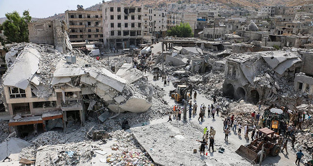 This photoshows the scene after a government warplane crashed in the center of the town of Ariha, in the northwestern province of Idlib, Syria, Monday, Aug. 3, 2015. (AP Photo)