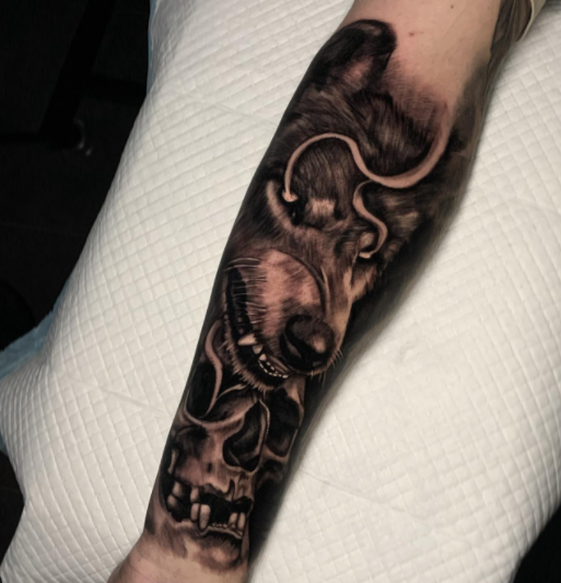 Skull And Alpha Wolf Forearm Tattoo