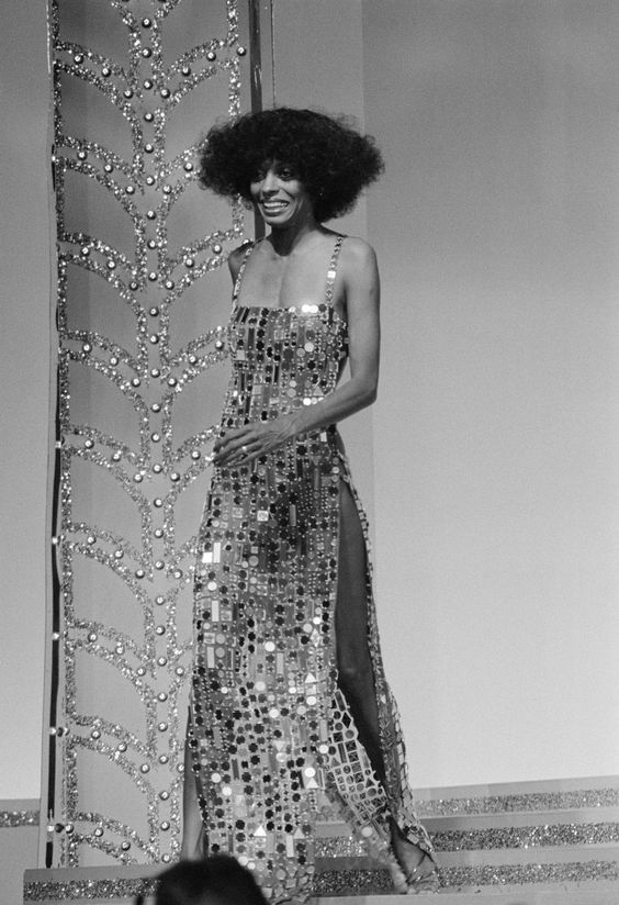 Diana Ross at the second annual Rock Music Awards   wearing a glittery dress that reps 70s women's fashion


