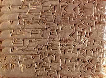 Example of cuneiform writing etched into a stone tablet.