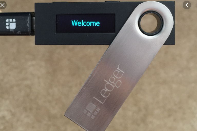 A Ledger hardware cryptocurrency wallet opened is displaying a welcome message.