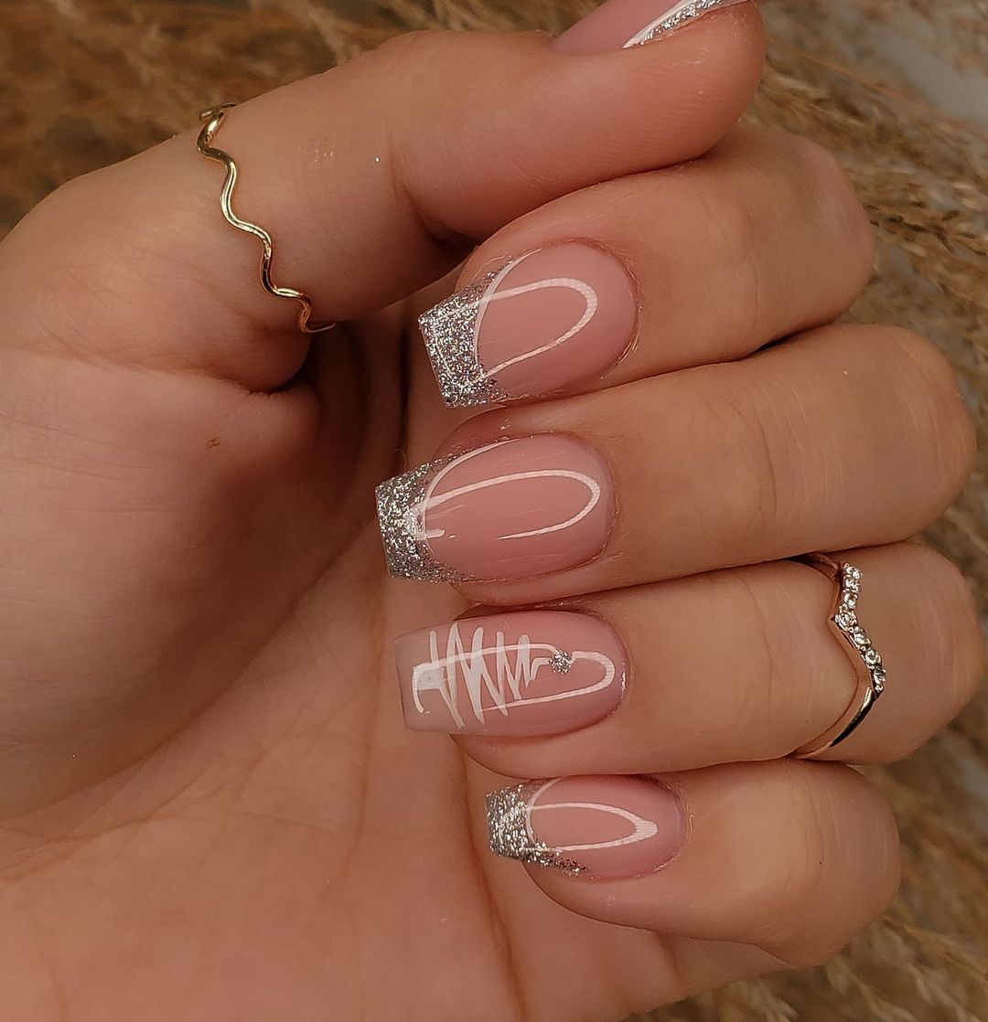 Glossy silver-tipped French nails