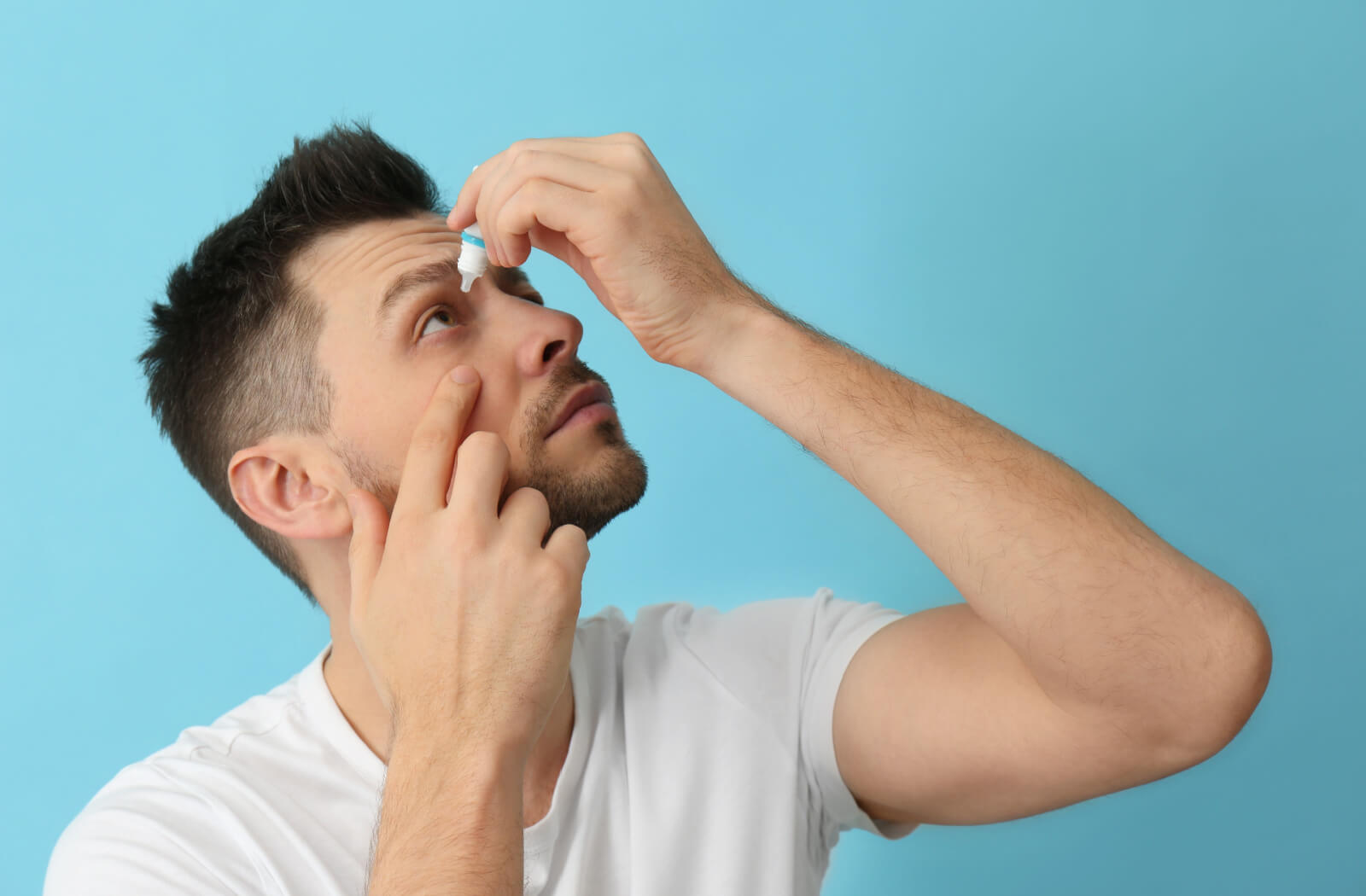 left hand and putting them on his right eye due to dry eyes.