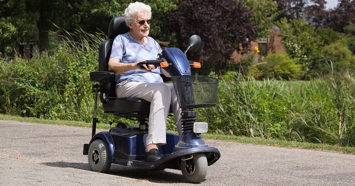 Senior woman using scooter
