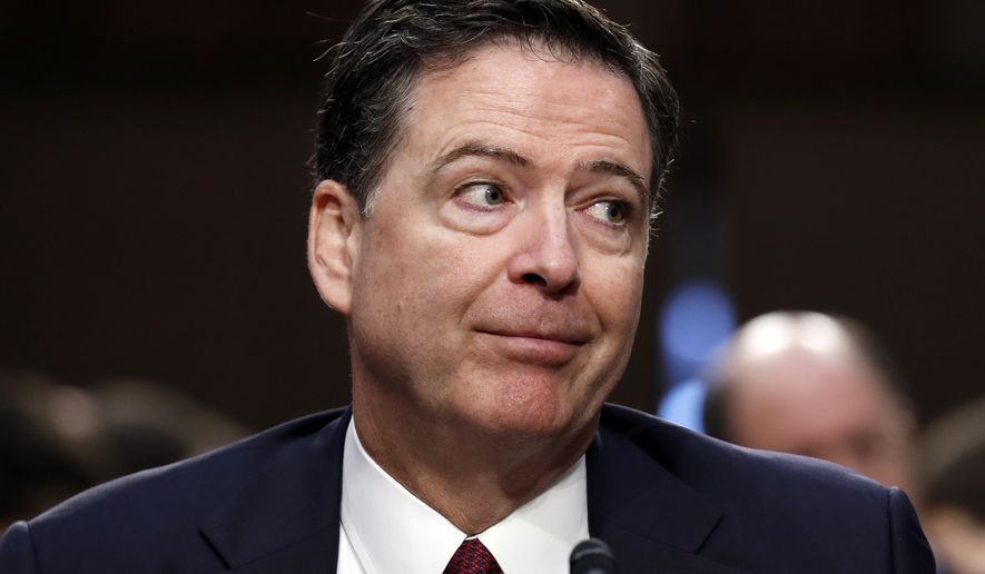 In this June 8, 2017, file photo, former FBI Director James Comey reacts during a Senate Intelligence Committee hearing on Capitol Hill in Washington. (AP Photo/Alex Brandon)