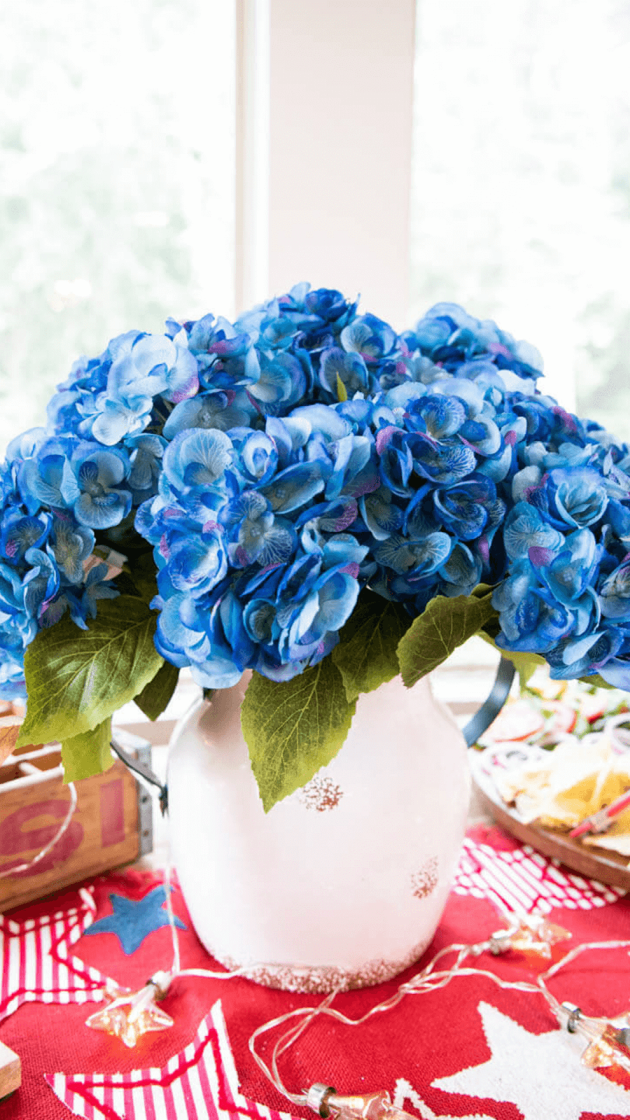 bright blue hydrangeas in neutral pot