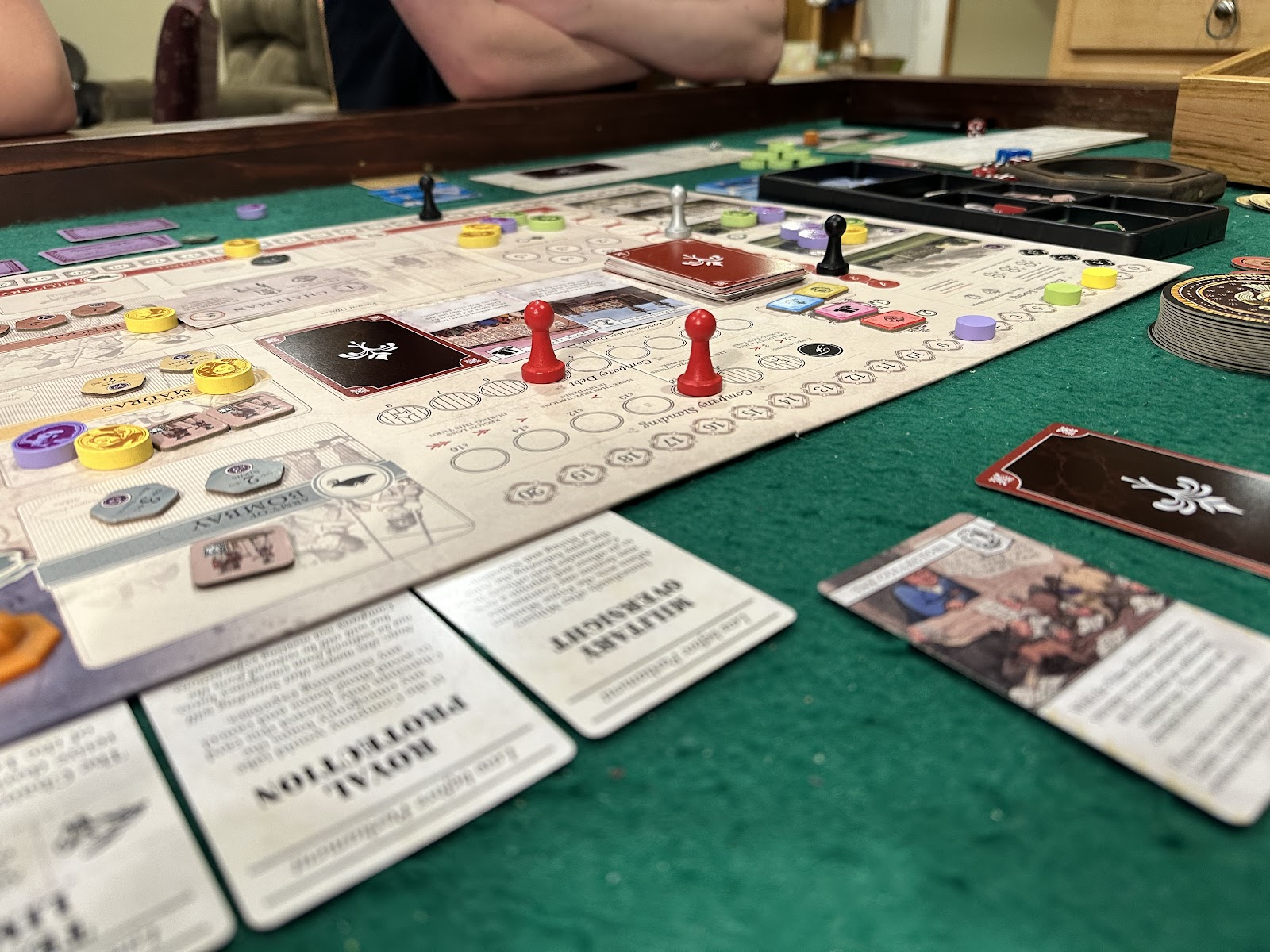 Tokens and pawns on top of the game board for John Company Second Edition