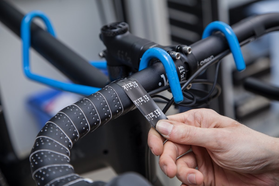 Wrap the bar tape around the handlebar, making sure that it overlaps properly.