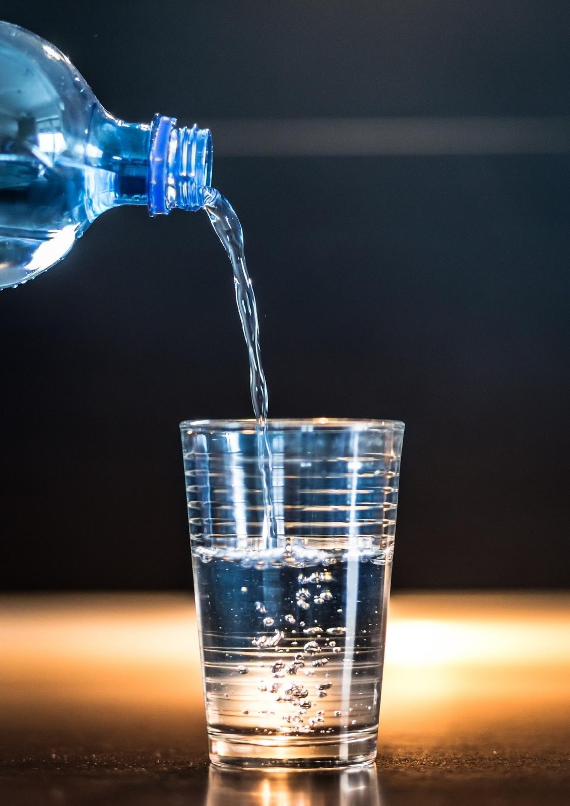 A picture containing glass, drinking water

Description automatically generated