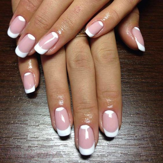 Lady shows off her beautiful pink and white tipped nails
