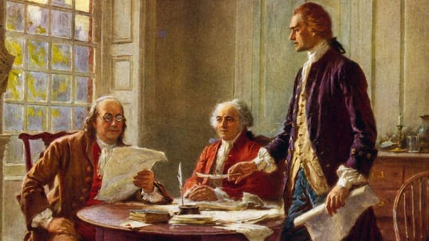 Benjamin Franklin and John Adams meeting with Thomas Jefferson, standing, to study a draft of the Declaration of Independence.