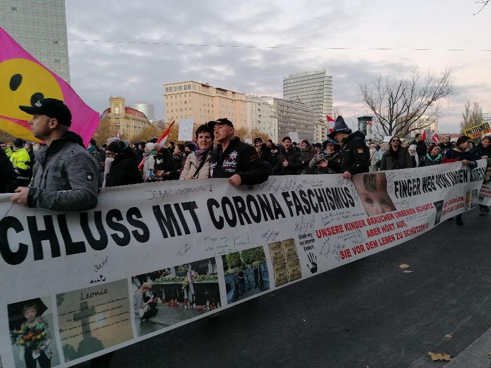 A group of people holding a banner

Description automatically generated with medium confidence