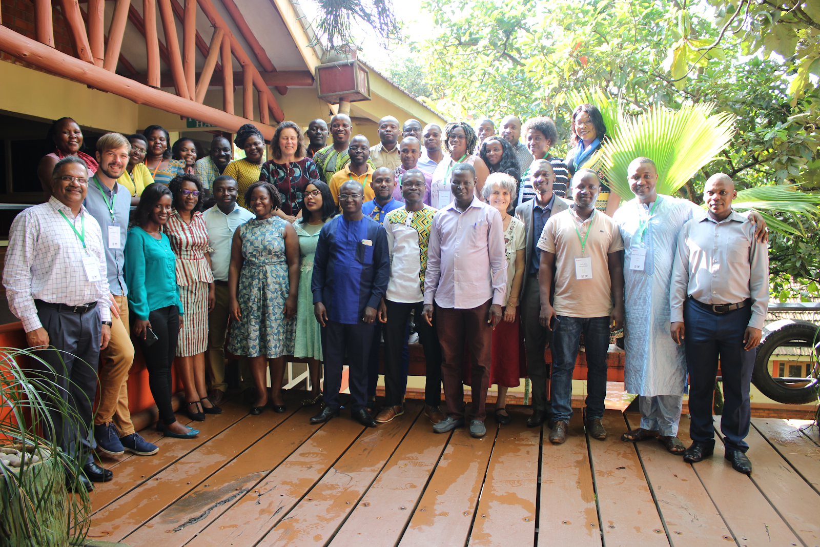 A group photo of participants and trainers, outside the training venue