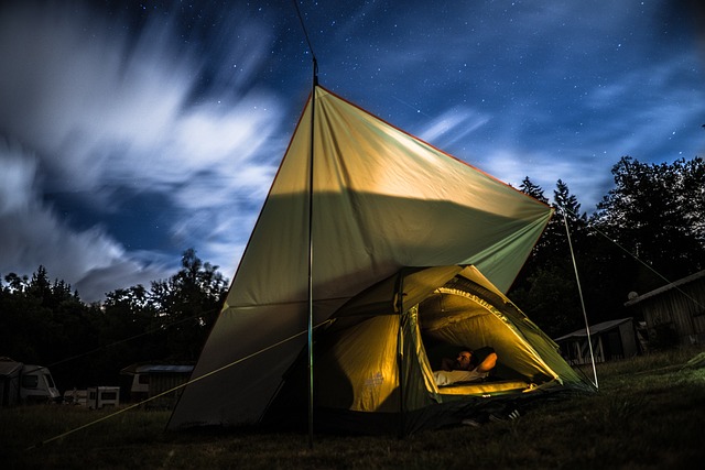 a man enjoying an indoor tent camping activity - things to do while camping at night