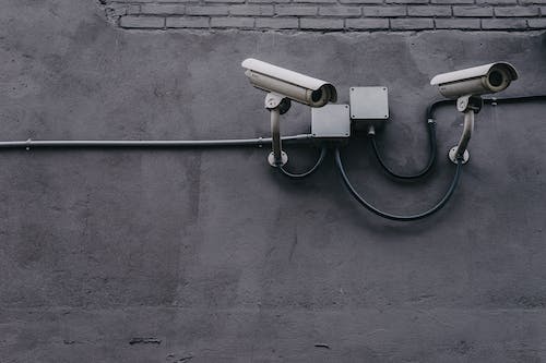 Free Two Gray Bullet Security Cameras Stock Photo