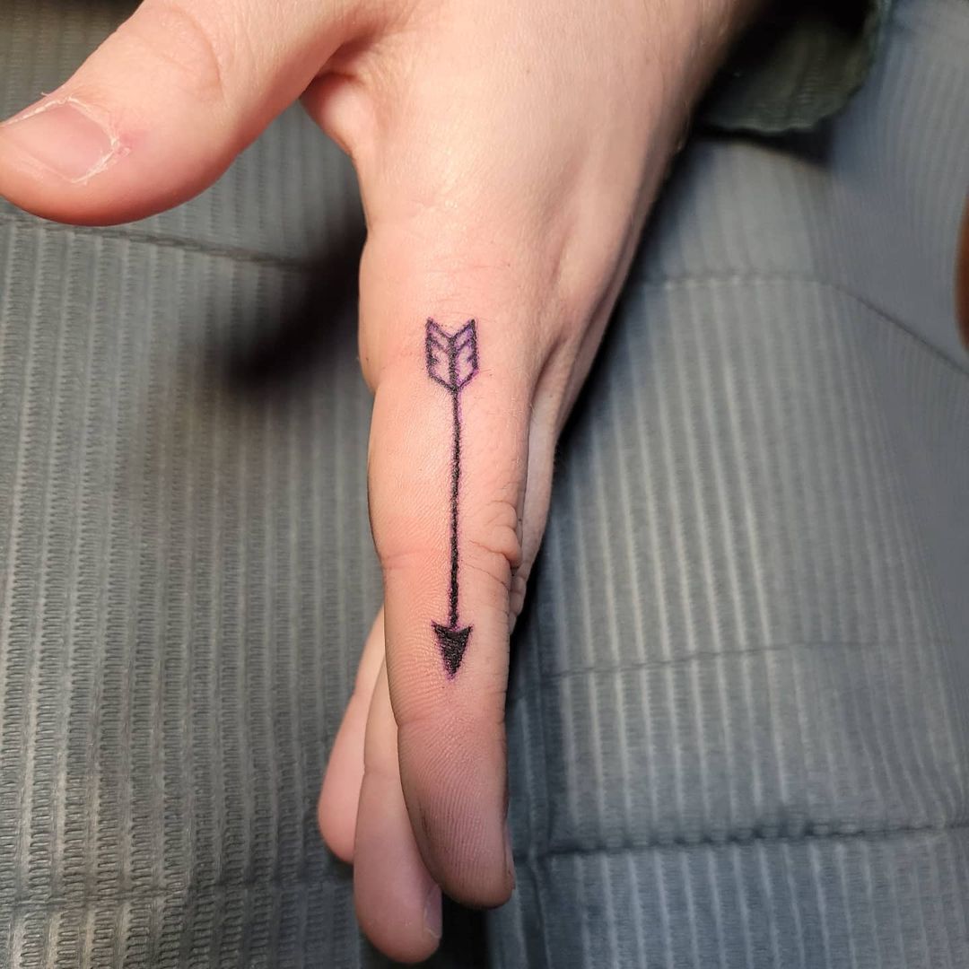 arrow tattoo on finger