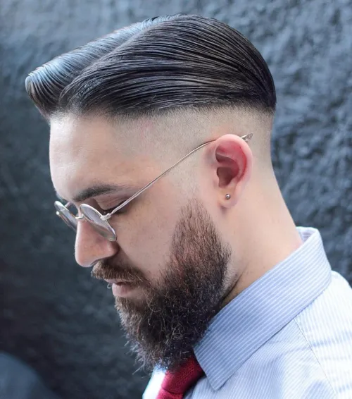 Guy shows off his peaky blinder look with this cool hairstyle