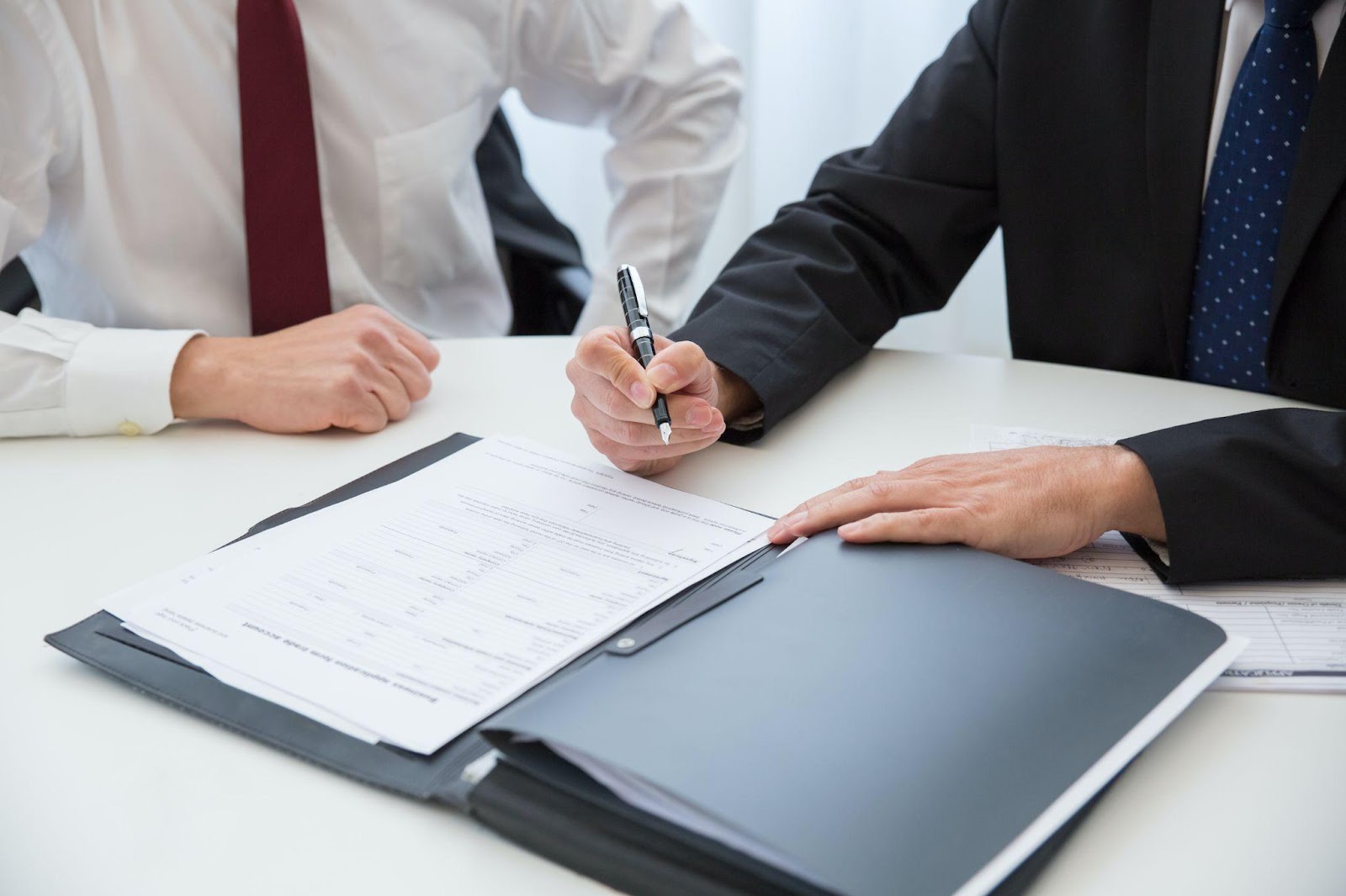 a person signing a rental agreement