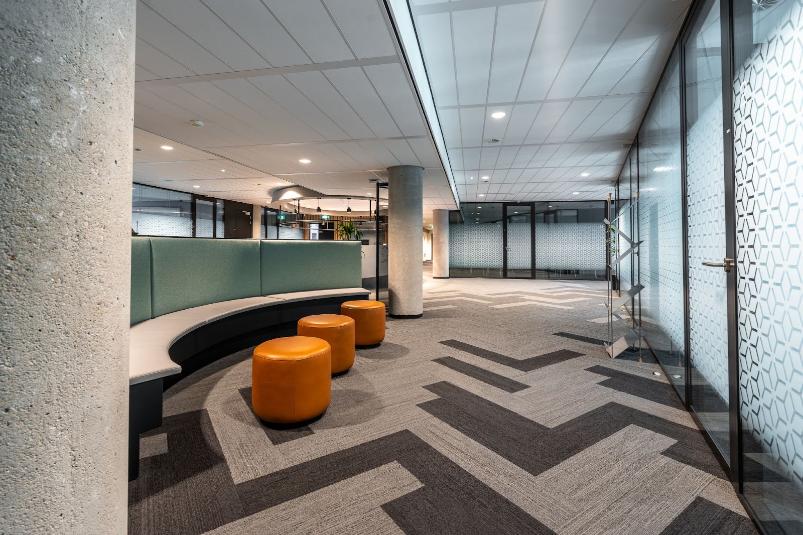 A conference section separated by a glass wall and door.