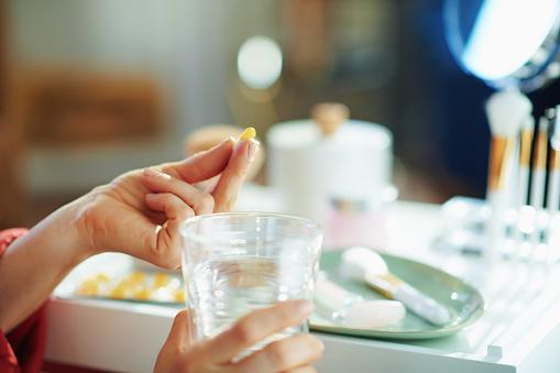 https://media.istockphoto.com/photos/woman-with-cup-of-water-taking-pill-near-table-with-toiletries-picture-id1211571682?b=1&k=6&m=1211571682&s=170667a&w=0&h=jJSVXFnJB4zH9POIS-ZFWiREocEyhN4NYsvC0PFCG3Y=