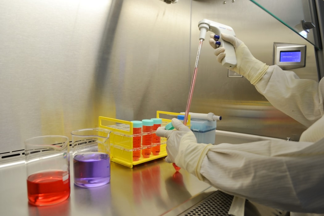 A scientist working with samples in lab