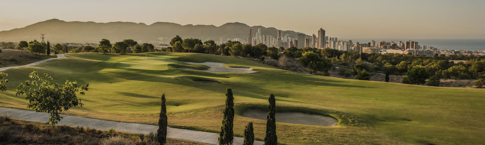 Villaitana Golf course with Benidorm skyline in the background during sunset