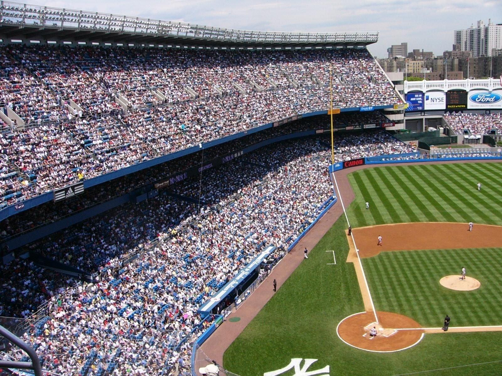 A baseball stadium full of people

Description automatically generated with low confidence