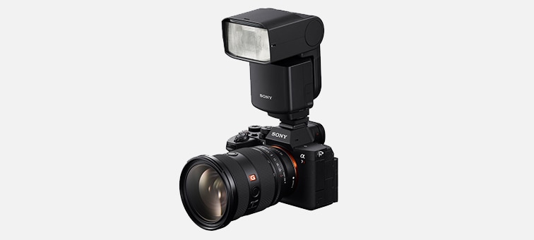 Image of α7R V with a flash unit attached