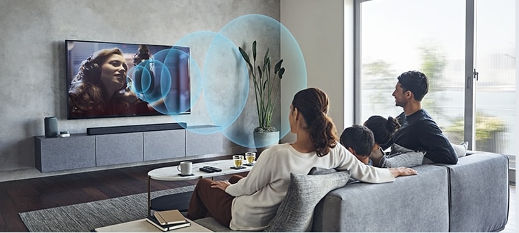 Image of couple in living room watching BRAVIA TV with Acoustic Center Sync