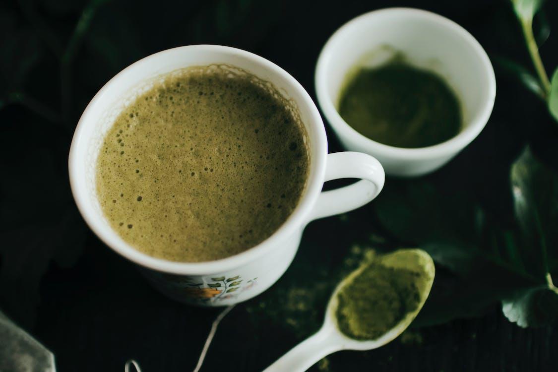 Free Close-Up Photo of Matcha Latte on a Ceramic Cup Stock Photo