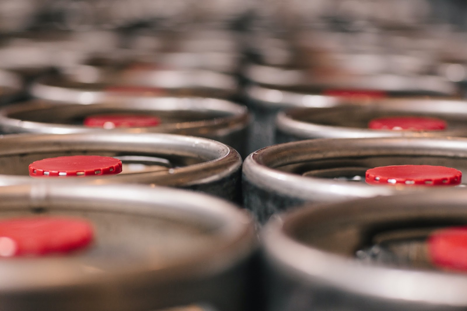 Rows of untapped beer kegs are pictured up-close.