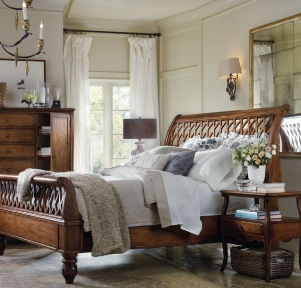 Use decorative pillows and pillow shams to decorate a sleigh bed.