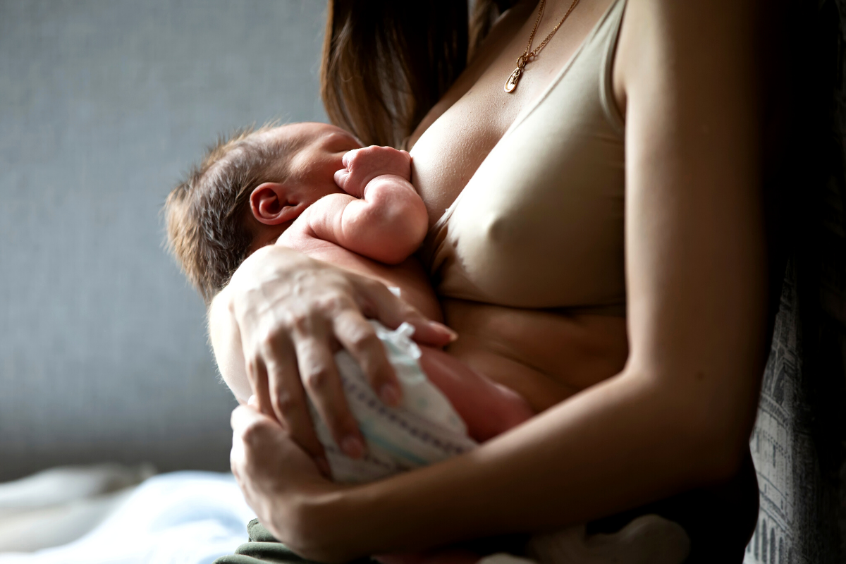 mother breastfeeding newborn