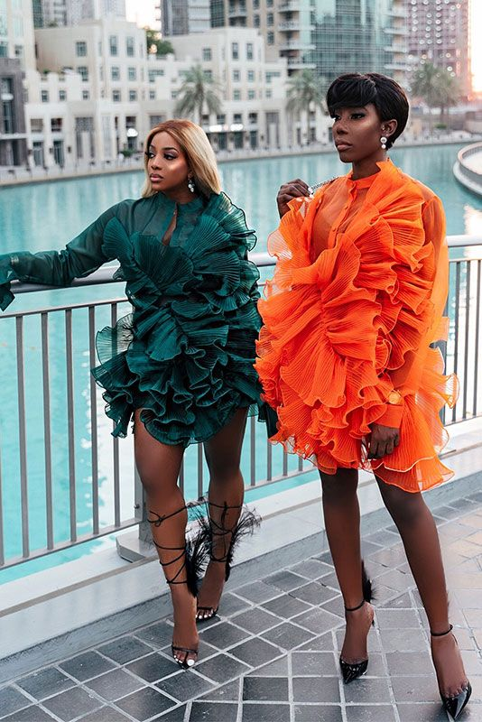 2 ladies wearing green and orange chic fashion styles