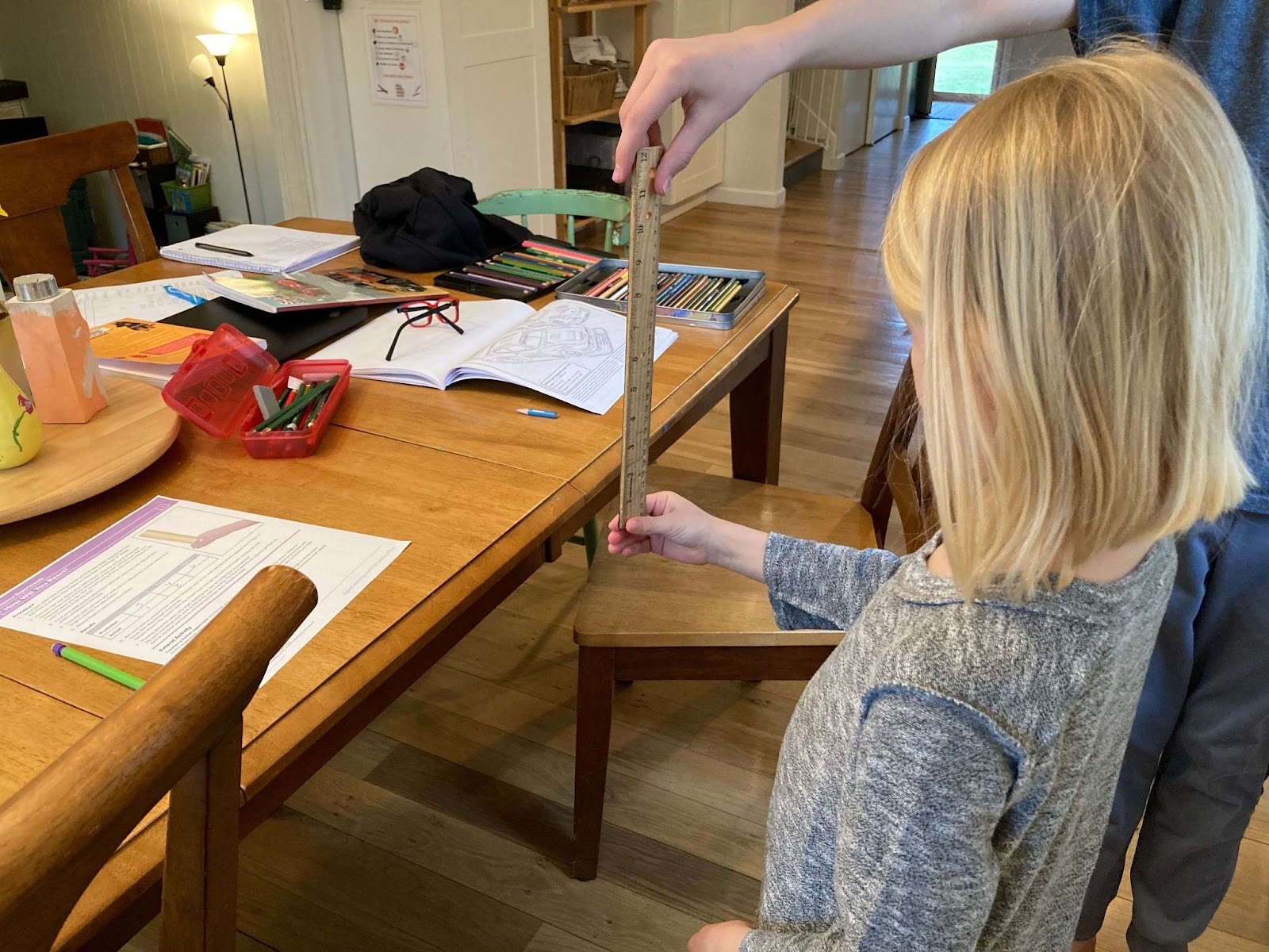 child conducting science experiment using Homeschool+ Online Learning Program Review