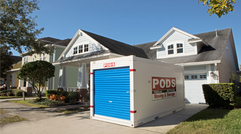 A PODS container sitting in front of a home in Asheville