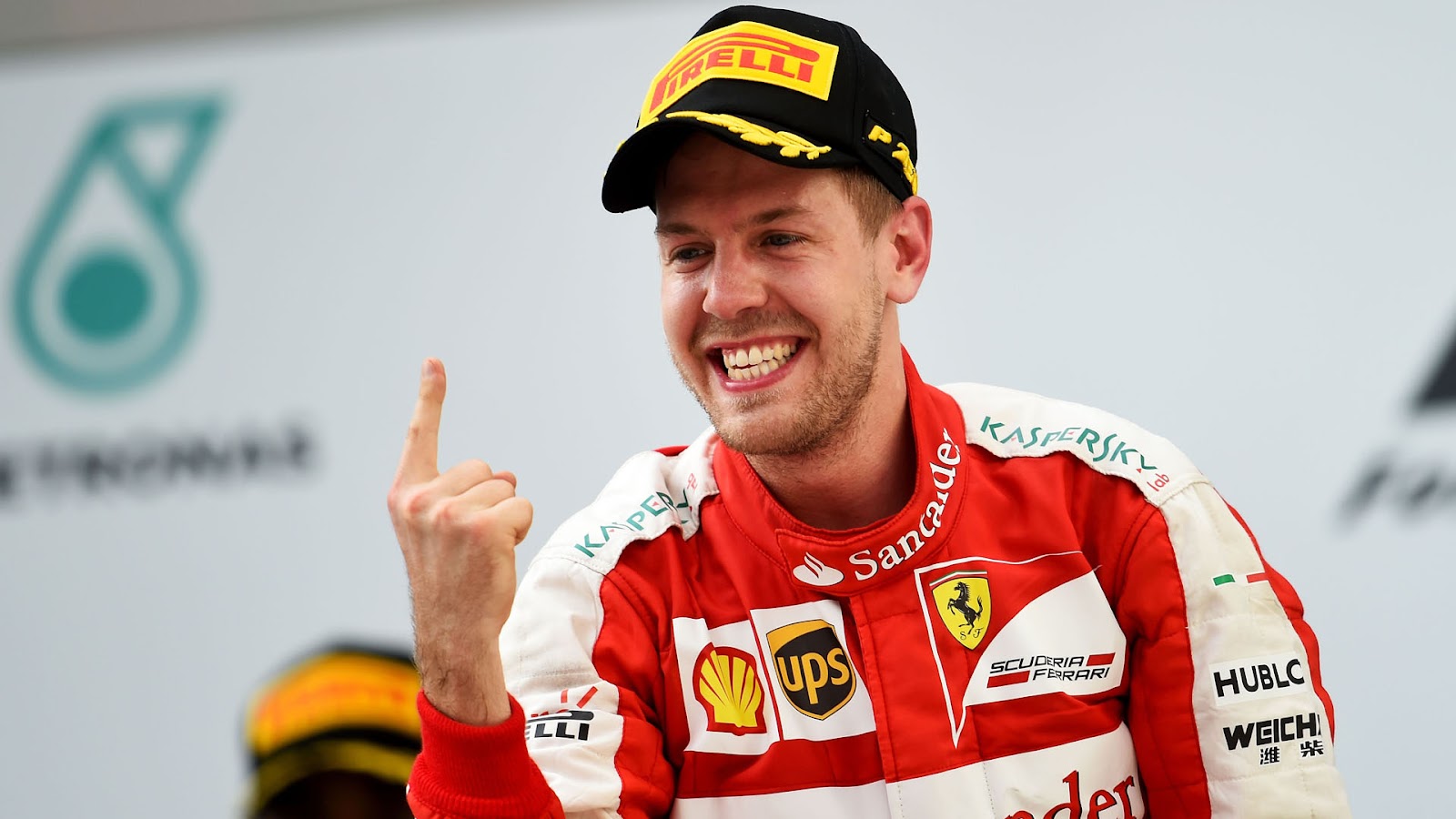 Vettel doing his trademark one finger victory salute