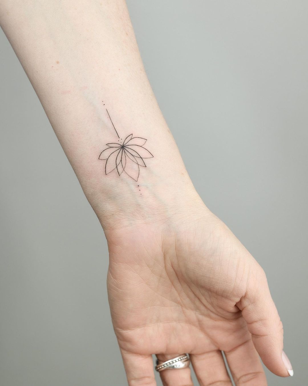 Fine-Line Lotus Flower Tattoo